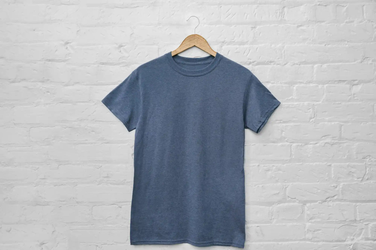 Blue t-shirt on hanger.