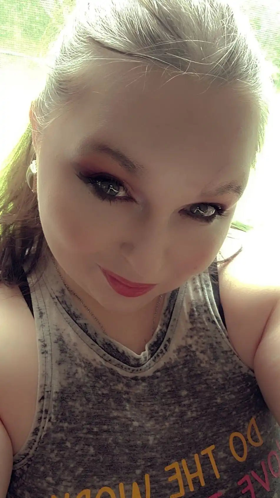 Woman in tank top.